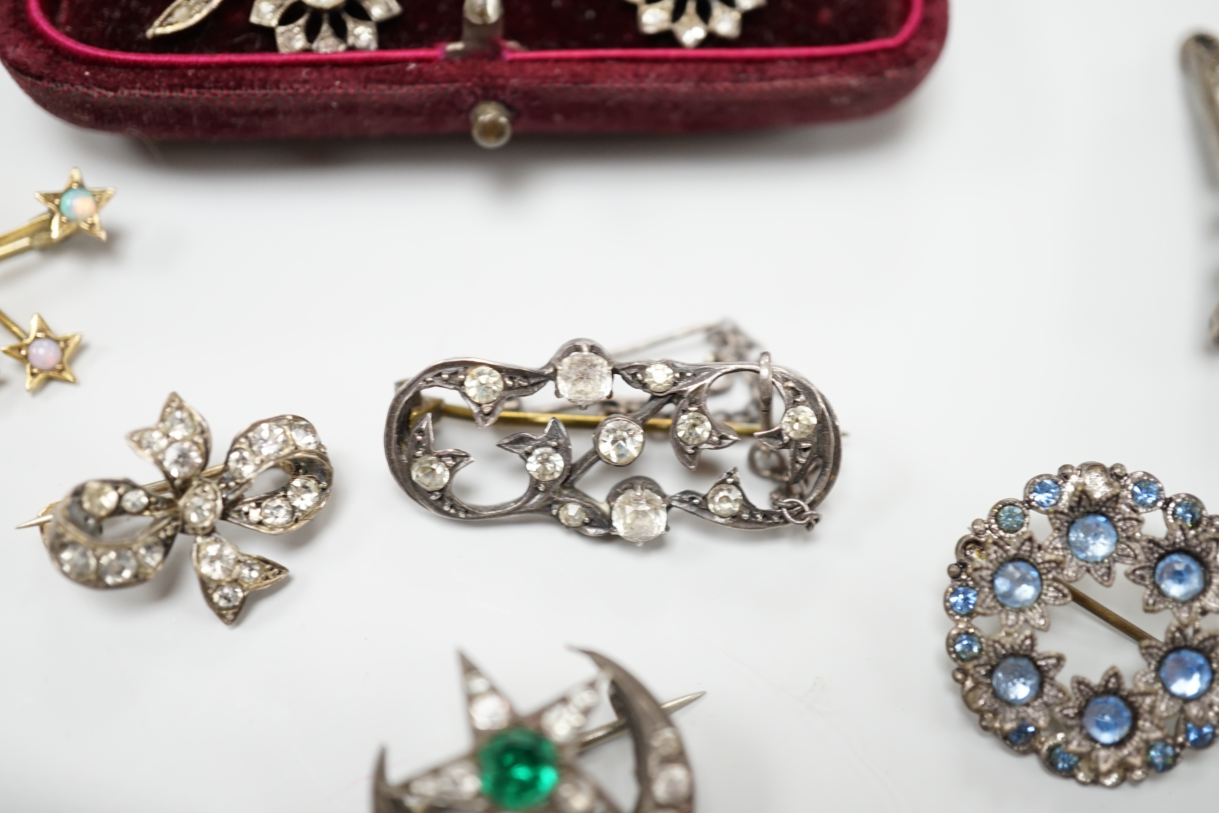A group of mainly paste set jewellery including a pair of 9ct gold, silver and paste drop earrings and an opal set constellation brooch